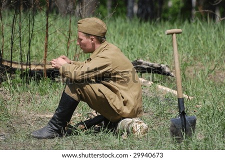 KIEV, UKRAINE - MAY 9: A member of history club called Red Star wears historical Soviet uniform as he participates in a WWII reenactment may 9, 2009 in Kiev, Ukraine.