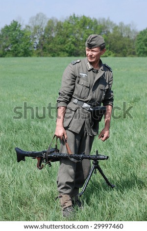 KIEV, UKRAINE - MAY 9: A member of a military history club wears a historical German uniform as he participates in a WWII reenactment in Kiev, Ukraine May 9, 2009.