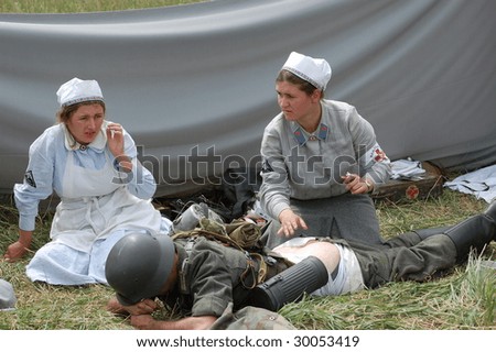 KIEV,UKRAINE - 9 MAY: Woman in German WW2 military German nurse uniform. Member of military history club Red Star. Historical military reenacting in Kiev, Ukraine on May 9, 2009.