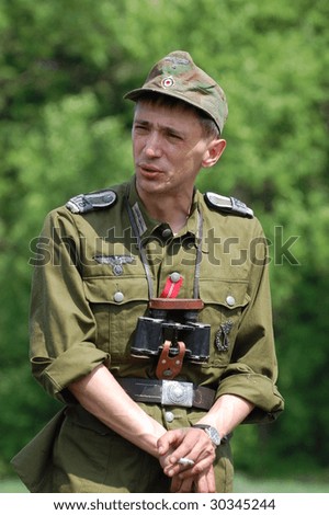 KIEV, UKRAINE - MAY 9: A member of a military history club wears a historical German uniform as he participates in a WWII reenactment May 9, 2009 in Kiev, Ukraine.