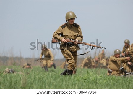 KIEV, UKRAINE - MAY 9: Members of history club called Red Star wear historical Soviet uniform as they participate in a WWII reenactment May 9, 2009 in Kiev, Ukraine.