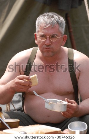 KIEV, UKRAINE - MAY 9: Member of a military history club wear historical German uniform as he participates in a WWII reenactment May 9, 2009 in Kiev, Ukraine.