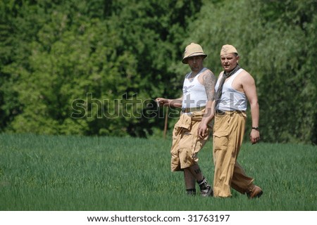 KIEV, UKRAINE - MAY 9: Members of a military history club wear a historical German parachutist tropical uniform as they participates in a WWII reenactment in Kiev, Ukraine May 9, 2009.