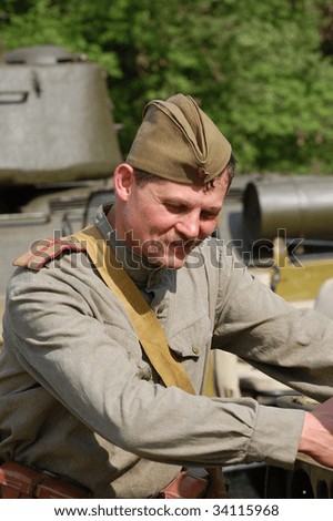 KIEV, UKRAINE - MAY 9: Member of history club called Red Star wears historical Soviet uniform as he participates in a WWII reenactment May 9, 2009 in Kiev, Ukraine.