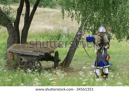 KIEV, UKRAINE - JULY 31: Member of history club Golden Capricorn wears  medieval costume as he participates in historical festival and camp in memory King Vladimir July 31, 2009 in Kiev, Ukraine.