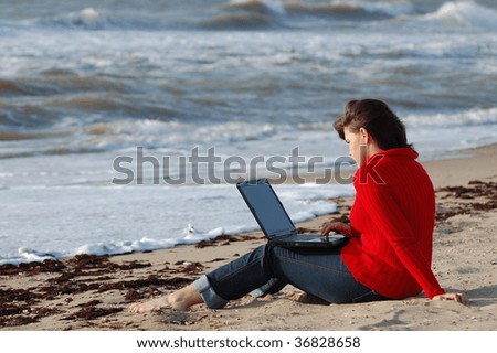 Student girl on the seashore with notebook. Black Sea coast. Near Odessa,Ukraine