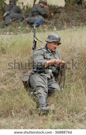 KIEV, UKRAINE - SEPT 6, : Member of a history club wears a historical German uniforms as he participates in a WWII reenactment.Defense Kiev in 1941. September 6 , 2009 in Kiev, Ukraine