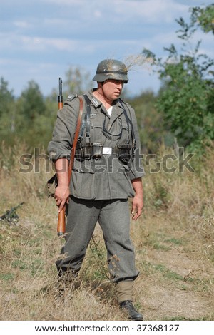 KIEV, UKRAINE - SEPT 19, : Member of a history club wear historical German uniforms as he participates in a WWII reenactment.Buttle for Kiev in 1943. September 19 , 2009 in Kiev, Ukraine