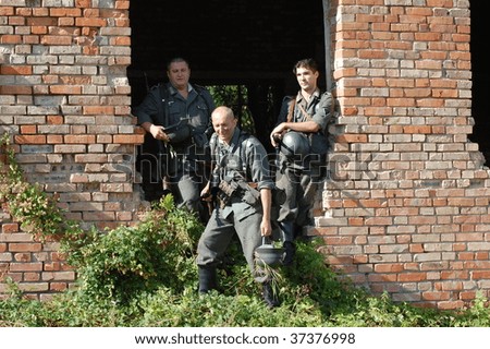 KIEV, UKRAINE - SEPT 19, : Members of a history club wear historical German uniforms as they participates in a WWII reenactment.Buttle for Kiev in 1943. September 19 , 2009 in Kiev, Ukraine