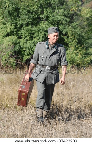 KIEV, UKRAINE - SEPT 19, : Member of a history club wear historical German uniforms as he participates in a WWII reenactment.Battle for Kiev in 1943. September 19 , 2009 in Kiev, Ukraine