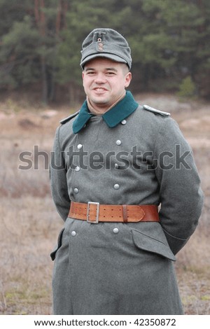 Member of a history club wears historical German uniforms of WW2