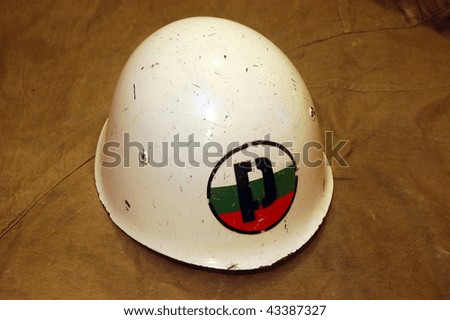 Bulgarian battle helmet (M51)(1951)  This white shell with the P-and-flag logo denotes Bulgarian Military Police.Extremely similar to the Italian M33, this helmet was adopted by the Bulgarian forces