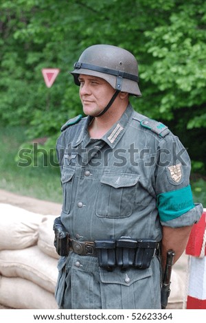 KIEV, UKRAINE - MAY 8 : A member of Red Star history club wears historical German uniform during historical reenactment of 1945 WWII, May 8, 2010 in Kiev, Ukraine.
