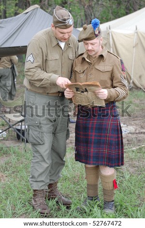 KIEV, UKRAINE - MAY 10 :  members of Red Star history club wears historical British&US uniforms during participation in 1945 WWII reenactment May 10, 2010 in Kiev, Ukraine.