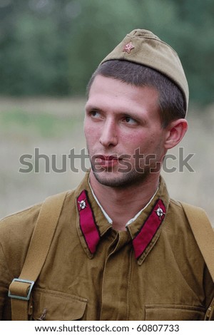 CHERNIGOW, UKRAINE - AUG 29: A member of Red Star military history club wears historical Soviet uniform during historical reenactment of WWII, August 29, 2010 in Chernigow, Ukraine