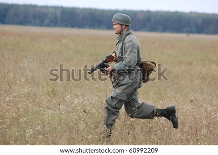 CHERNIGOW, UKRAINE - AUG 29: A member of Red Star military history club wears historical German paratrooper uniform during historical reenactment of WWII, August 29, 2010 in Chernigow, Ukraine