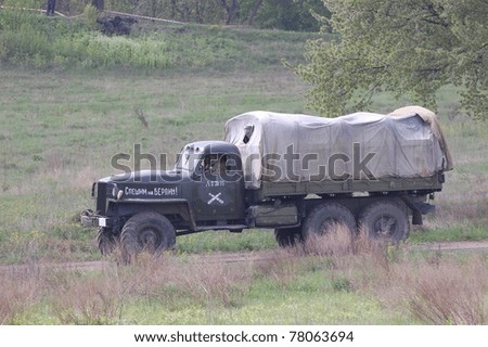 KIEV, UKRAINE - MAY 8 : Unidentified member of Red Star history club drives a WW2 Soviet truck during historical reenactment of WWII on May 8, 2011 in Kiev, Ukraine