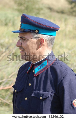 KIEV, UKRAINE -SEPT 17 : A member of Red Star history club wears historical Soviet Police uniform during historical reenactment of WWII, September 17, 2011 in Kiev, Ukraine