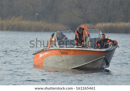 KIEV, UKRAINE -NOV 3: Ukrainian Civil Protection lifeboat   during historical reenactment of WWII, Dnepr river crossing 1943, November 3, 2013 . Kiev, Ukraine