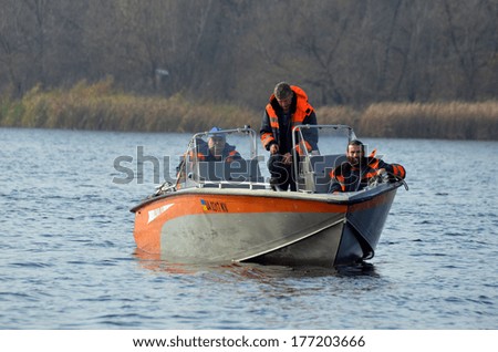 KIEV, UKRAINE -NOV 3: Ukrainian Civil Protection lifeboat during historical reenactment of WWII, Dnepr river crossing 1943, November 3, 2013 . Kiev, Ukraine