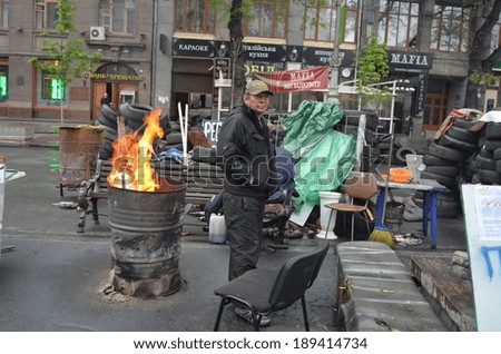 KIEV, UKRAINE - APR 19, 2014:People in the rioters camp in downtown.Main street of Kiev. Putsch of Junta in Kiev. Kiev.April 19, 2014 Kiev, Ukraine