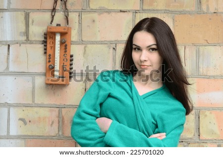 Teen girl with outdoor thermometer.Near Kiev,Ukraine. Winter coming