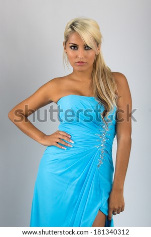 Pretty blonde woman with light blue sky dress