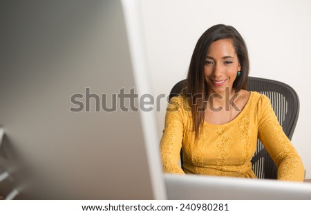 Businesswoman happy working on her computer at the office