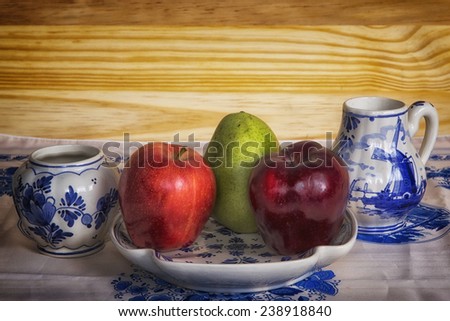 Apple, Pear, Blue Serving Dish, Cream and Sugar bowl on a Table Cloth