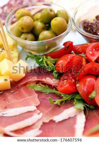 Sliced cold cuts (prosciutto, olives, cheese)