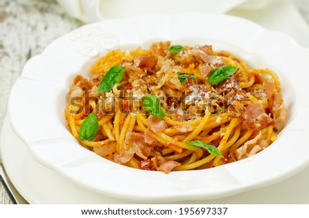 Pasta with tomato sauce and bacon
