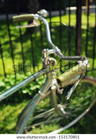 An old-fashioned green vintage bike handlebars