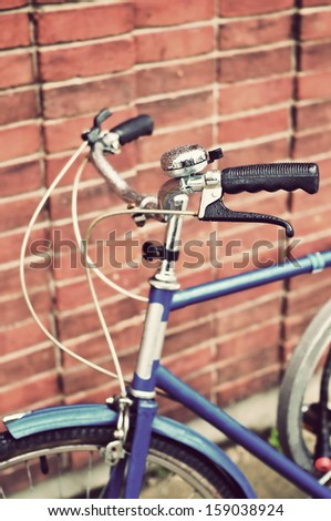 An old-fashioned blue vintage bike handlebars - with droplets
