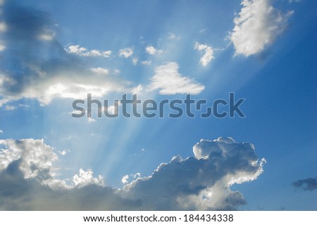Sunlight streaming from behind a cloud