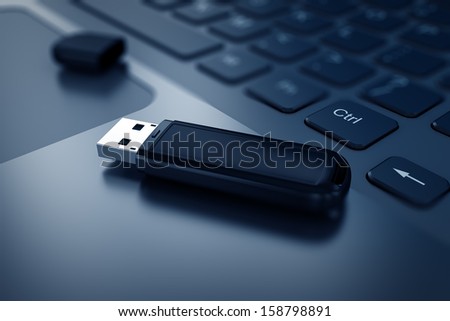 Modern Usb Flash Drive On Laptop Keyboard