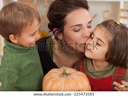 Family showing affection while preparing for autumn holidays