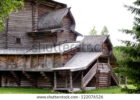 A traditional wooden russian house in a summer forest