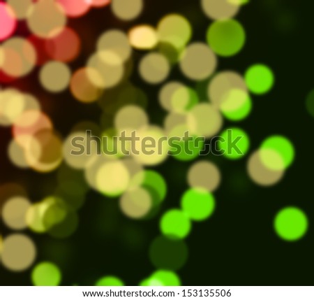 Green, golden and red bokeh on dark phone. Abstract winters holiday - Christmas and New Year\'s background