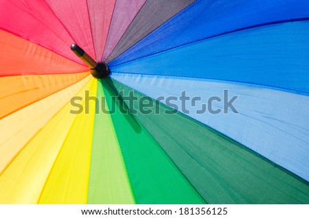 Abstract color background with open Rainbow umbrella
