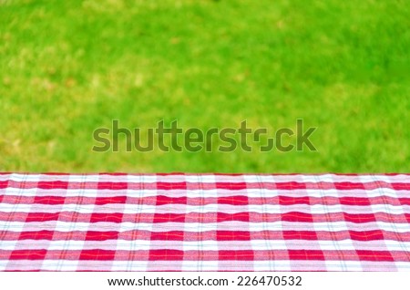 Picnic tablecloth textile on the table background