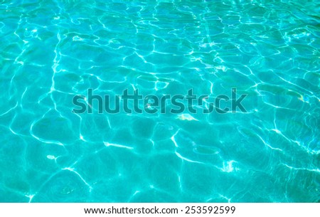 Turquoise clear ocean water background in sunny day