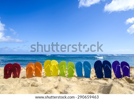 Colorfull flip flops on the sandy beach in Hawaii, Kauai
