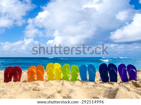 Colorful flip flops on the sandy beach in Hawaii, Kauai