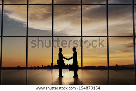 Two Business shake hand silhouettes rendered with computer graphic.