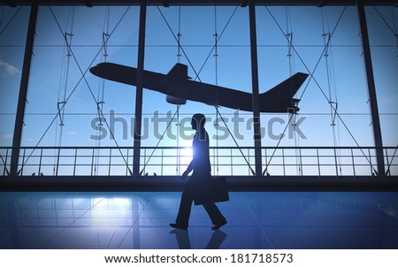 Business man walking alone silhouette in the airport