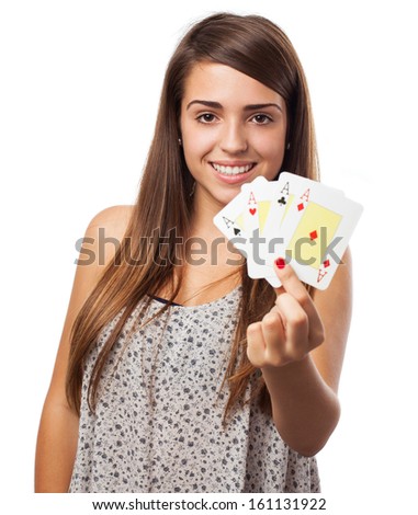 portrait of young woman showing poker cards isolated on white