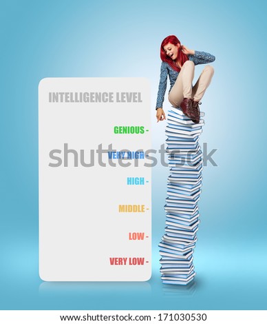 young woman sitting on a books tower measuring her intelligence level