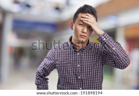 young asian man with problems, worry gesture