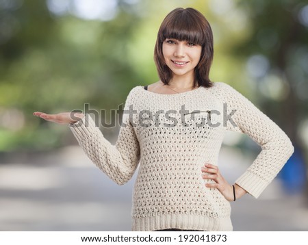 portrait of beautiful young woman holding something