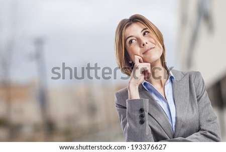 Thoughtful and beautiful young happy woman executive